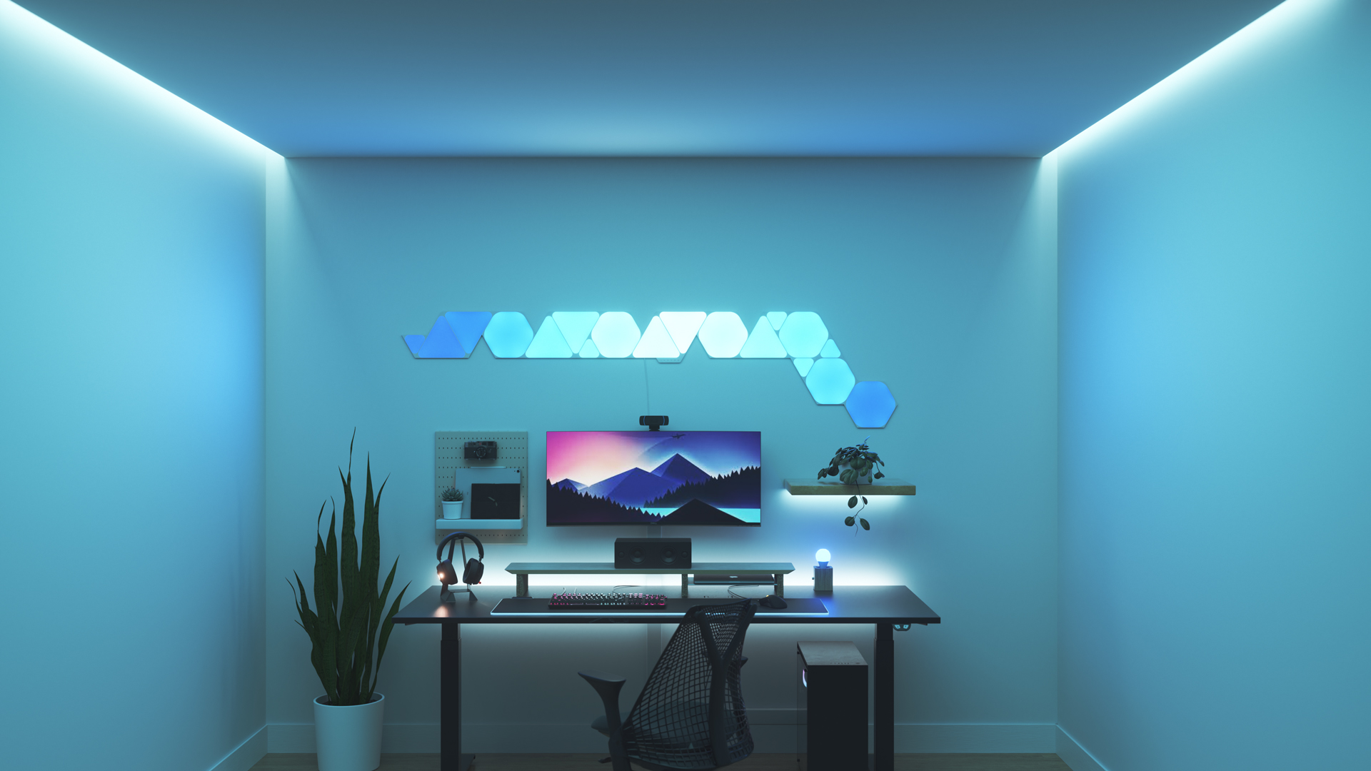Minimalistic style gaming setup with Nanoleaf Shapes smart home RGB light panels above the monitor. PC games are better with these gaming lights.