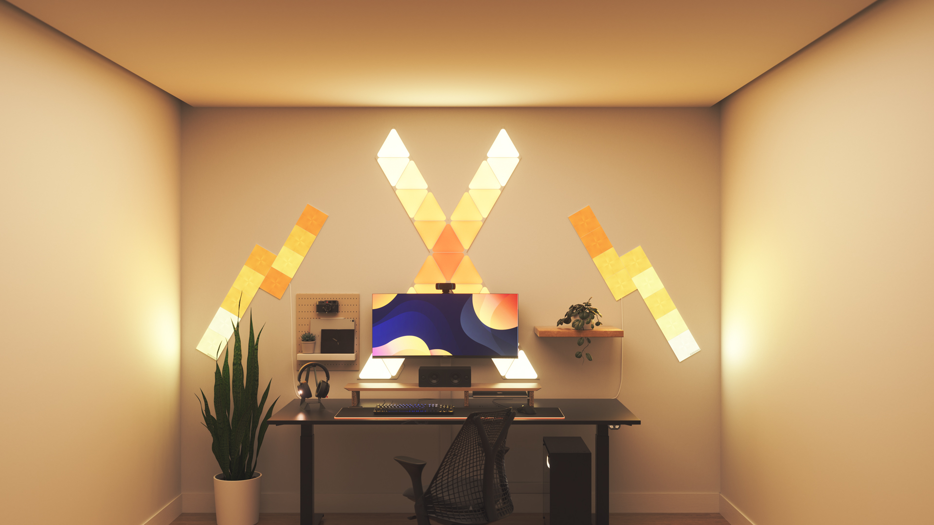 Kawaii style gaming setup with Nanoleaf Shapes Triangle smart home RGB light panels above the PC monitor. The perfect smart lights to complete the gamer aesthetic.