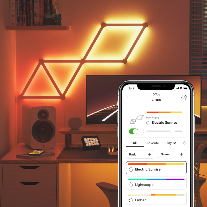 Nanoleaf Lines Thread enabled color changing smart modular backlit light lines mounted to a wall in a home office. Nanoleaf App. HomeKit, Google Assistant, Amazon Alexa, IFTTT.